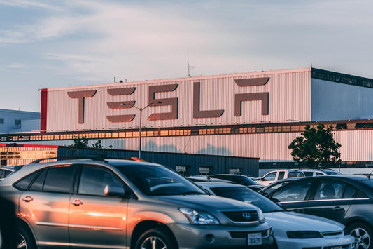 Gasoline cars in front of a Tesla factory